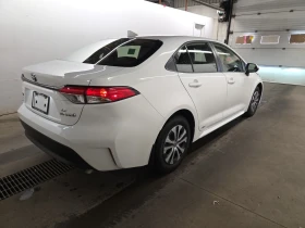 Toyota Corolla Hybrid LE CVT AWD * CARFAX * АВТО КРЕДИТ * | Auto.bg — изображение 4 Toyota Corolla Hybrid LE CVT AWD * CARFAX * АВТО КРЕДИТ * | Auto.bg — изображение 4