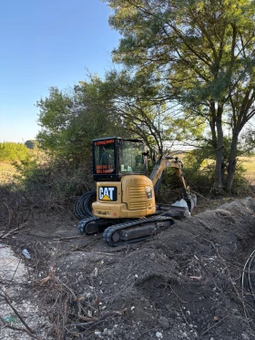 Багер Caterpillar 303E CR