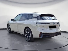 BMW iX M70 XDRIVE SKY-LOUNGE H/K PANORAMA 360-CAMERA | Auto.bg — изображение 2 BMW iX M70 XDRIVE SKY-LOUNGE H/K PANORAMA 360-CAMERA | Auto.bg — изображение 2