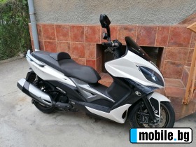     Kymco Xciting 400i ABS ~5 600 .