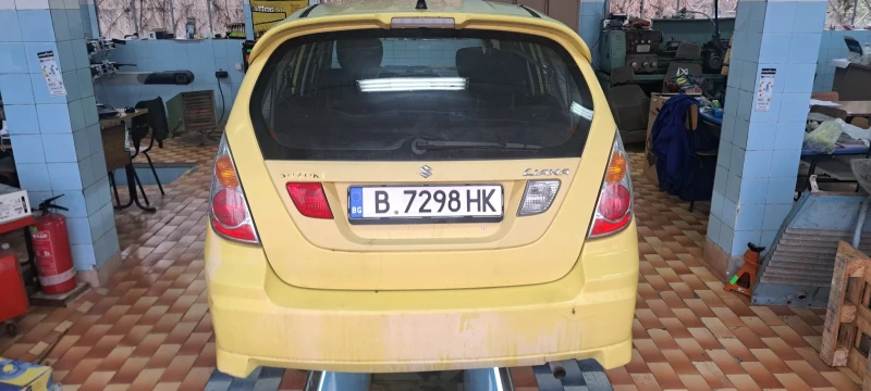 Suzuki Liana 1.6, снимка 14 - Автомобили и джипове - 53508045