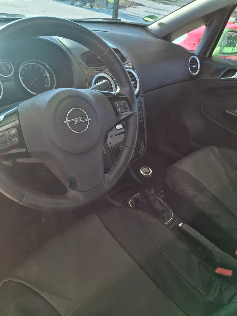 Opel Corsa 1.4 90к.с парктроник, климатик, снимка 11 - Автомобили и джипове - 52555392