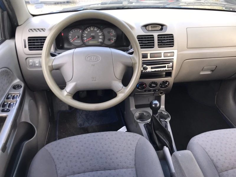 Kia Rio 1.4i, снимка 11 - Автомобили и джипове - 44312873