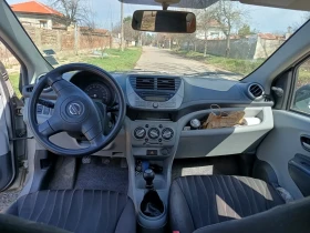 Nissan Pixo 2009 г., снимка 13