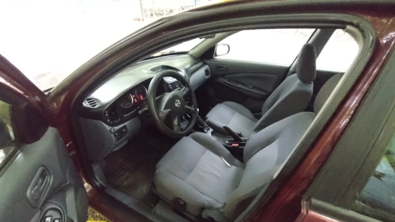 Nissan Almera N16, снимка 6 - Автомобили и джипове - 52318693