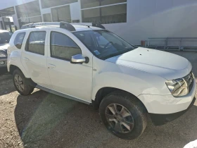 Dacia Duster 1.6i 4x4  - 8999 € / 17600.51 лв. - 12450277 3