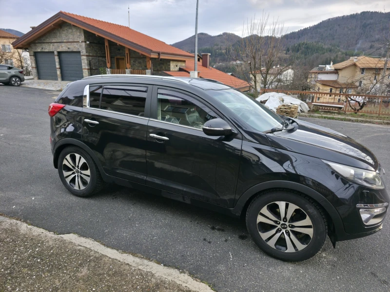 Kia Sportage 2.0i/4x4/АВТОМАТ, снимка 4 - Автомобили и джипове - 52679391