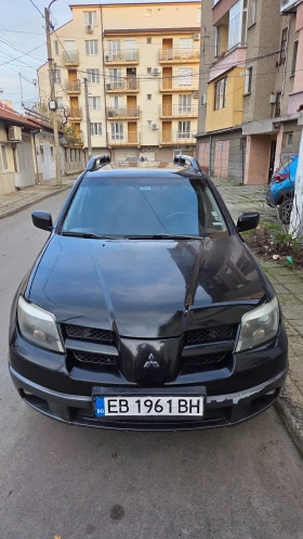 Mitsubishi Outlander 2.4 Газ/Бензин 4х4 - изображение 1