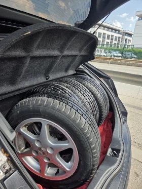 ����� �� �������� �� ���� � ������ 185/120R14 �� Peugeot 206