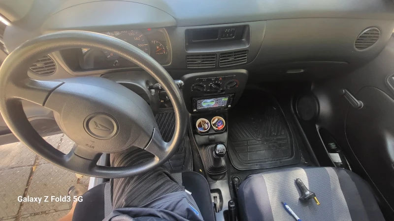 Daihatsu Cuore, снимка 12 - Автомобили и джипове - 52323457