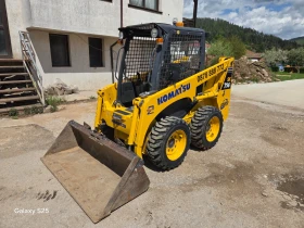 Мини челни товарачи Komatsu SK 714, снимка 1