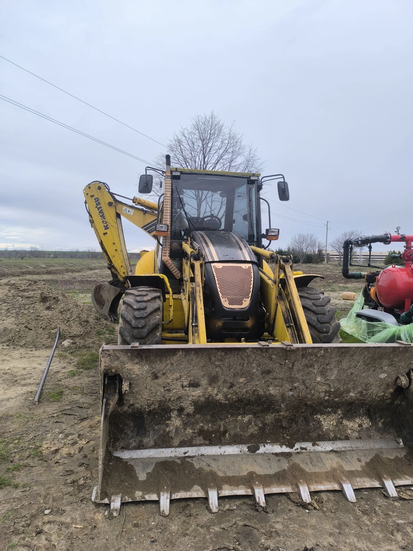 Багер Komatsu WB93S