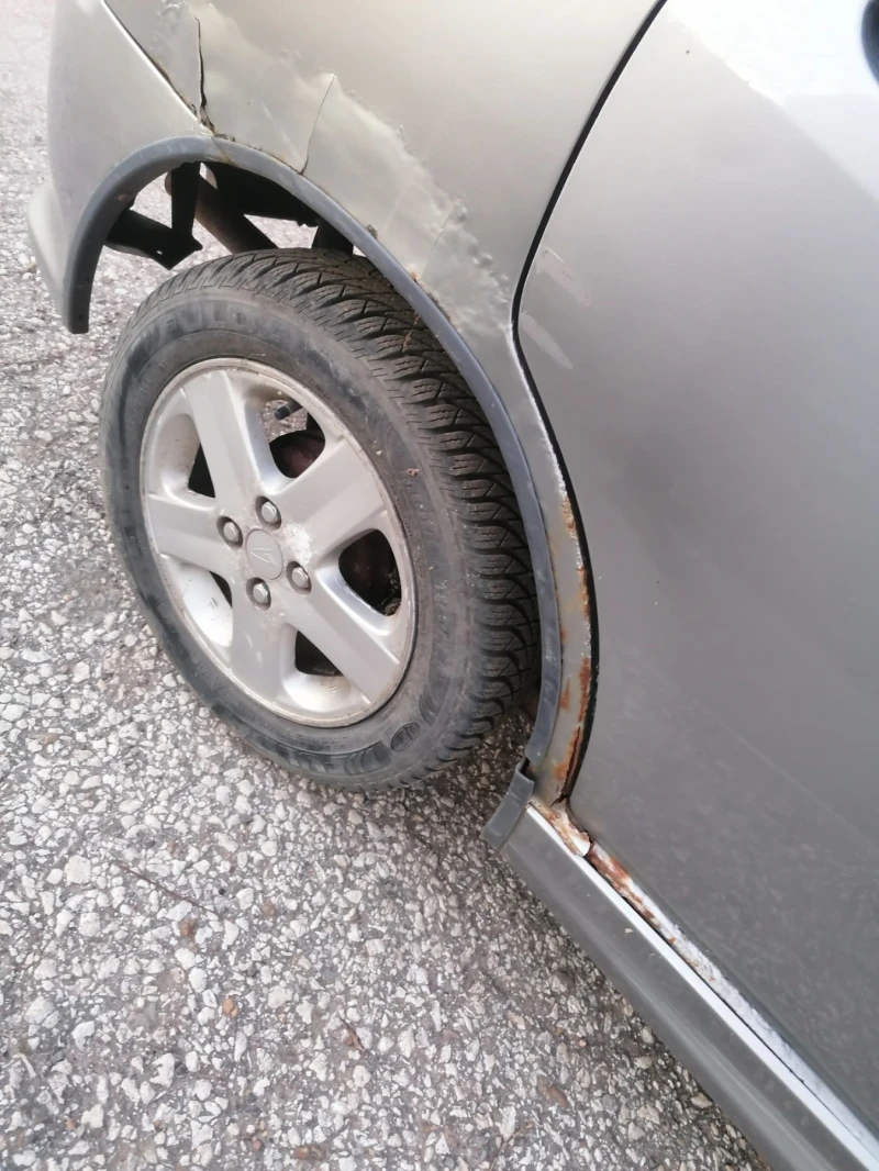 Daihatsu Sirion, снимка 14 - Автомобили и джипове - 52927844