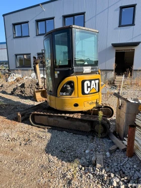 Багер Cat 303C 