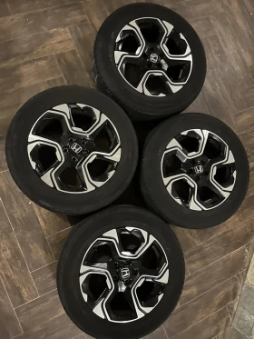        235/60R18  Honda Cr-v