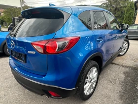 Mazda CX-5 2.0i-4X4-AUTOMAT-NAVI-BOSE-КОЖА-CAMERA-PDC-EURO5B - 9998 € / 19554.39 лв. - 58602021 6