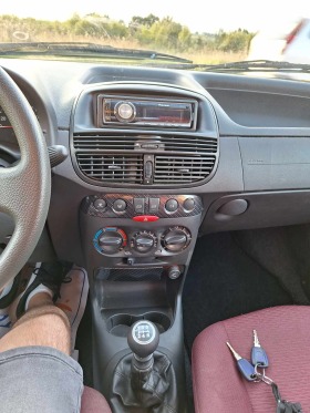 Fiat Punto 1.2i klima, снимка 10 - Автомобили и джипове - 45022481