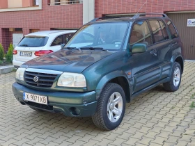 Обява за продажба на Suzuki Grand vitara 2.5i КЛИМАТИК ВЕРИГА ГАЗ 4X4 ОБСЛУЖЕН ~9 500 лв. - изображение 1