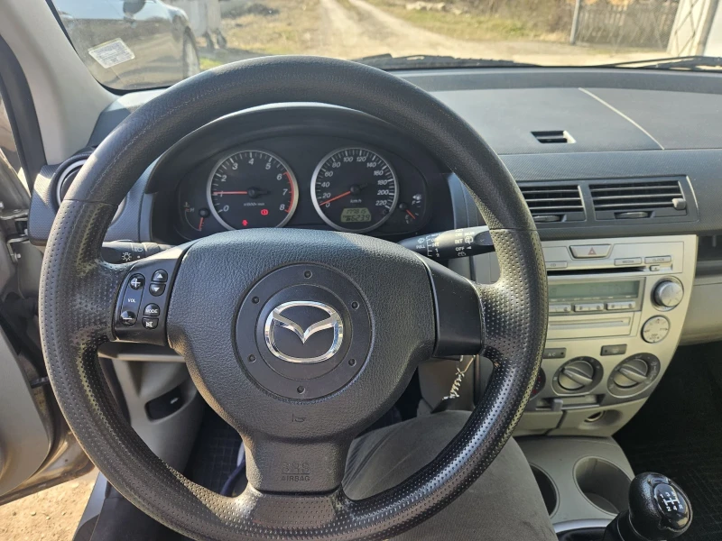 Mazda 2 1.3i 75коня, снимка 9 - Автомобили и джипове - 49164616