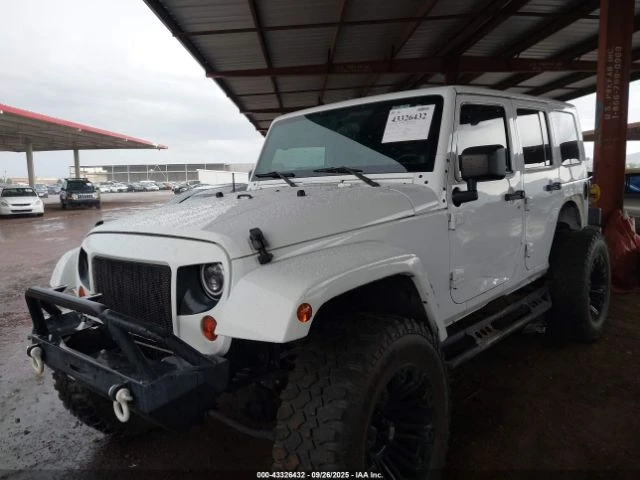 Jeep Wrangler UNLIMITED SPORT 2012 - изображение 2