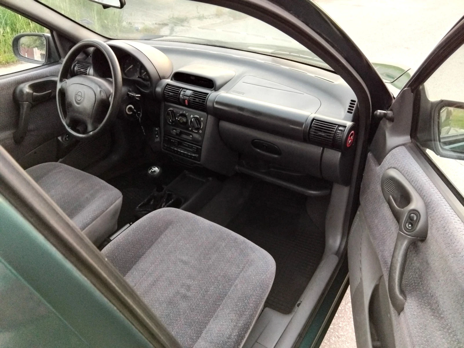 Opel Corsa 1.4.МОНО.75к+ КЛИМА + ГАЗ///, снимка 15 - Автомобили и джипове - 54697310