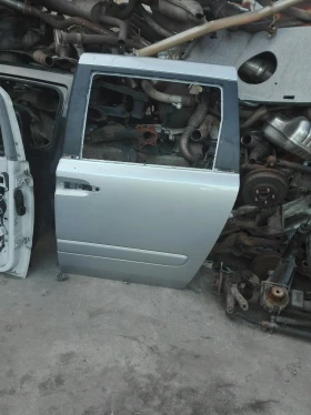 врата задна лява киа карнивал 08г