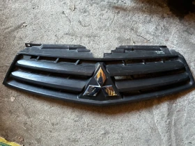 Предна решетка за Mitsubishi L200. 10-15г. Митсубиши. Л200. С забележки. (Едно счупено уше). , снимка 1