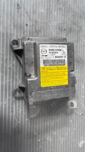     Airbag  /  /  a Mazda 3 - BCM557K30 / F01G07201K