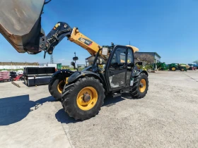 Телескопичен товарач Caterpillar TH 407C, снимка 9
