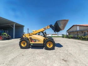 Телескопичен товарач Caterpillar TH 407C, снимка 1