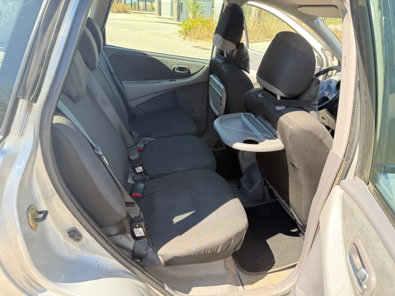 Nissan Almera tino 2.2 DCI, снимка 12 - Автомобили и джипове - 52384316
