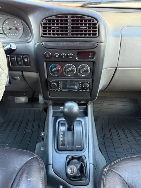 Kia Sportage 2.0 (128 кс), снимка 16