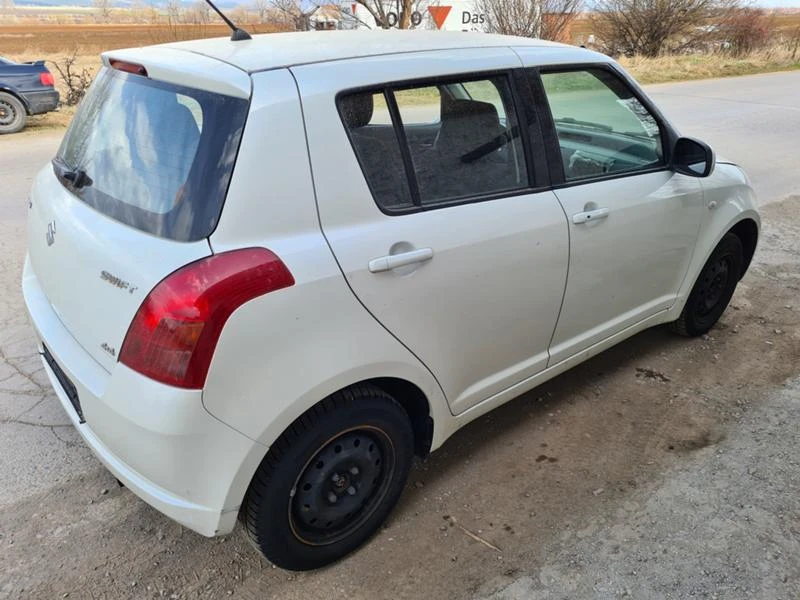 Suzuki Swift 1.3 4x4, снимка 7 - Автомобили и джипове - 47659765