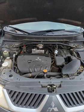 Mitsubishi Outlander 2.4 4x4 gas, снимка 16 - Автомобили и джипове - 45089075