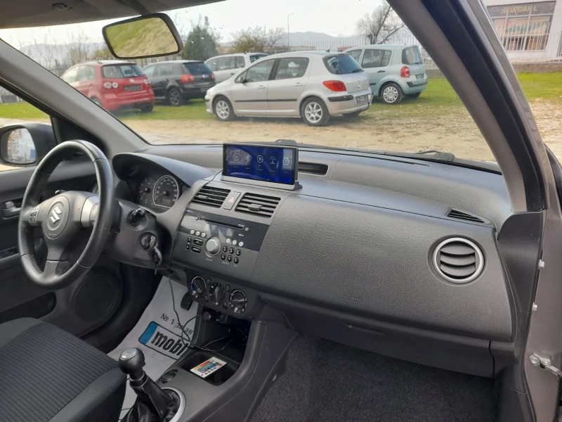 Suzuki Swift 1.3 DDIS, снимка 12 - Автомобили и джипове - 52535214