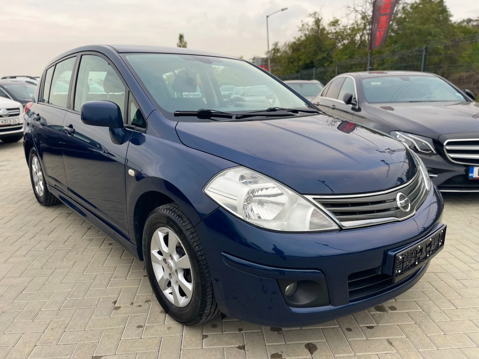 Nissan Tiida  - изображение 8