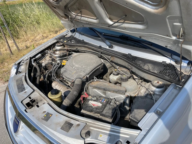 Dacia Logan 1.6/Климатик, снимка 14 - Автомобили и джипове - 51190032