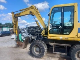 Багер Takeuchi TB 070W, снимка 1