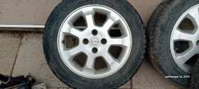        185/60R15  Opel Astra