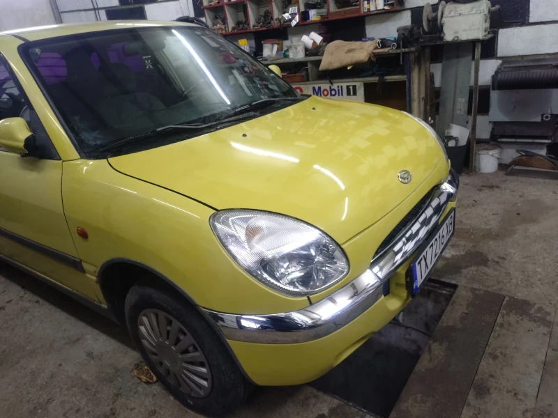 Daihatsu Sirion, снимка 13 - Автомобили и джипове - 53574302