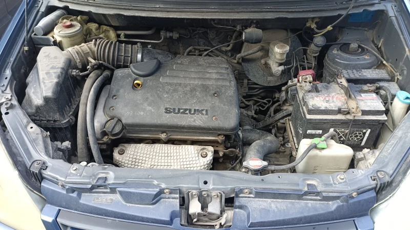 Suzuki Liana, снимка 9 - Автомобили и джипове - 52212863