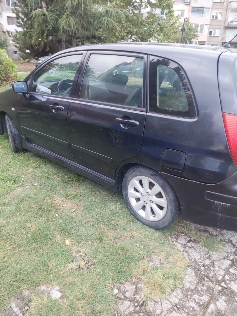 Suzuki Liana, снимка 6 - Автомобили и джипове - 52845821