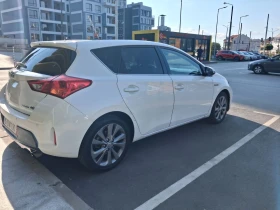 Toyota Auris 1.8 Hybrid, ниво Lounge, реален пробег - 8300 € - 26550713 4