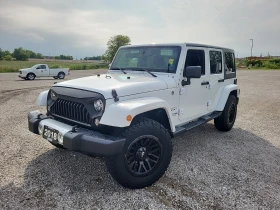 Jeep Wrangler 4x4 Sahara * CARFAX * АВТОФИНАНСИРАНЕ * , снимка 1