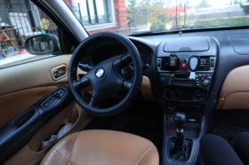 Nissan Almera - 1150 € - 37100223 9