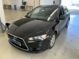     Mitsubishi Lancer 1.6  2-    
