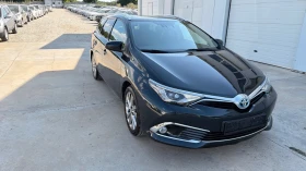 Toyota Auris 1.8i* Facelift Hybrid* Navi* Koja* Full*  - 8650 € / 16917.93 лв. - 16024534 12